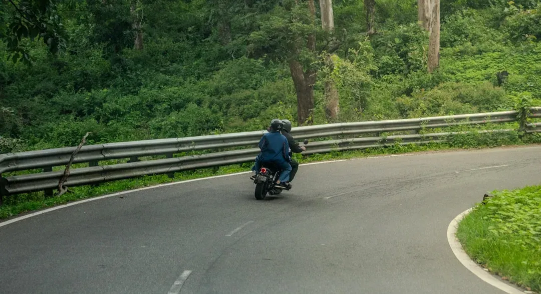 scooter on a winding road with scenic views of a caldera