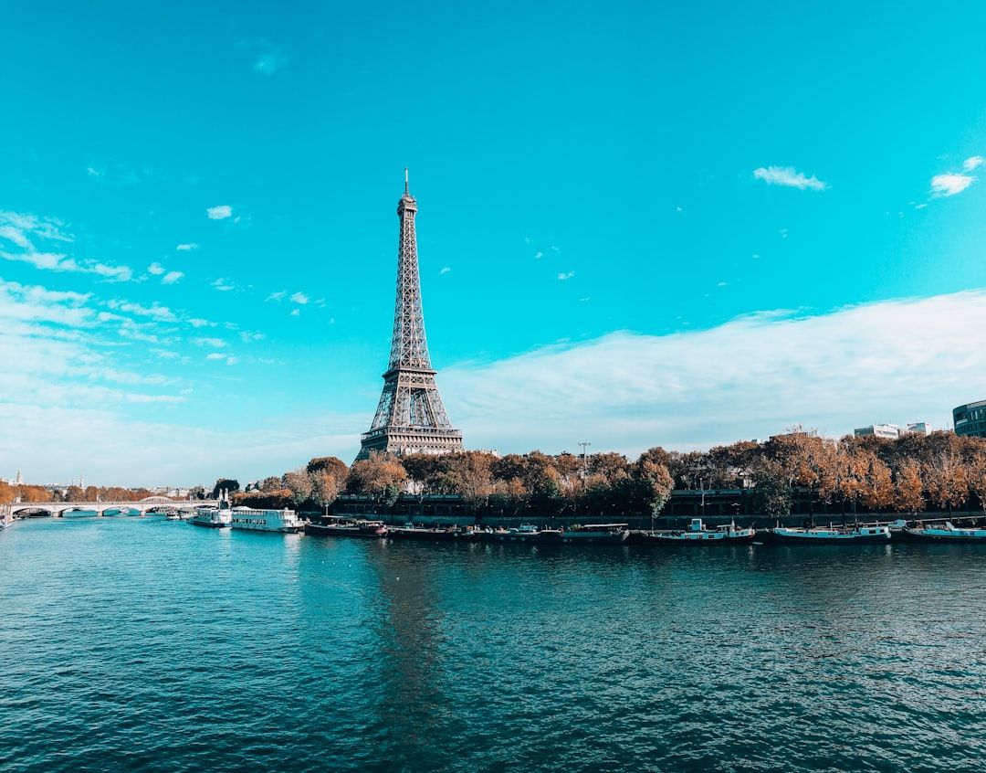 A luxury yacht sailing on the Seine with views of the Eiffel Tower and Notre Dame
