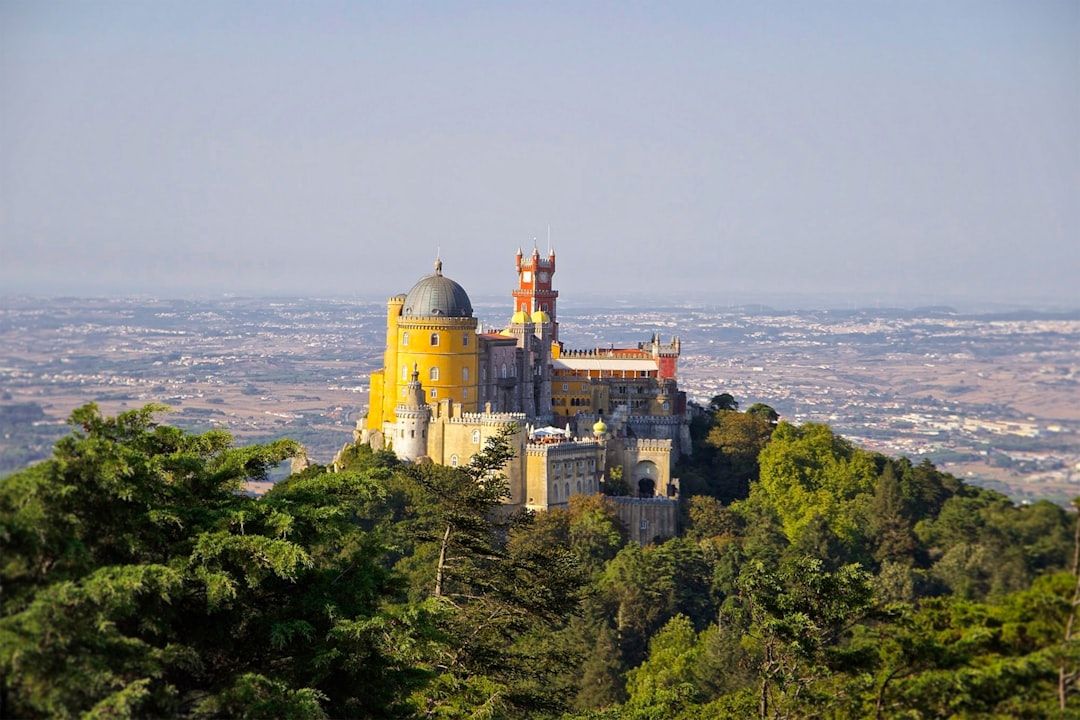 The brightly coloured Pena Palace on its hilltop above Sintra